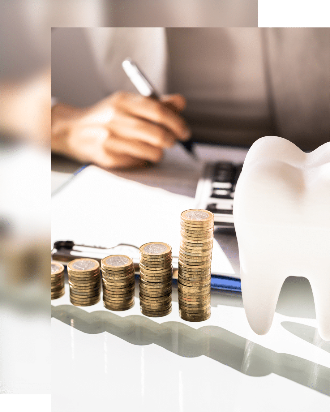 A person writes on a clipboard as stacked coins increase, with a large tooth model nearby suggesting dental expenses or savings.